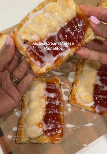 Guava Cream Cheese Pastelitos✨ I used 1 sheet of puff pastry but you can use 2 with a little less stuffing. (I jam packed mine and still had leftover filling) Ingredients: 1 sheet of pre-frozen pastry puff Egg wash or milk Filling: Premade Guava preserves Cream cheese filling: 8oz cream cheese 1/4 cup granulated sugar 1 teaspoon vanilla extract Glaze: 1/4 cup powdered sugar 1-2 teaspoons milk (adjust for consistency) Instructions: 1. Allow puff pastry sheet to defrost. 2. Cut into 6-9 pieces. 3.