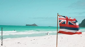 Flag of Hawaii on Waimanalo Bay State Recreation Park, Oahu, Hawaii. The longest stretch of sandy shoreline on Oahu