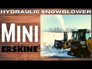 ASV RT-40 with a Mini Hydraulic Snowblower blowing hard frozen snow banks in parking lot