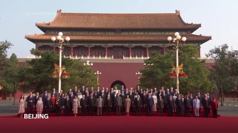 Xi poses for photo along with Kim, Putin and other leaders ahead of China military parade