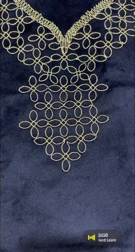 Intricate Embroidery Process on Dark Blue Velvet Fabric