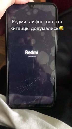 Cracked Redmi Smartphone Screen Close-Up