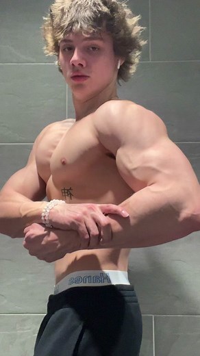 Muscular Male Showcase: Flexing Arms and Chest