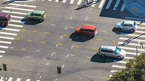 clip-7228087-traffic-intersection-timelapse-cars-pedestrians-zoom-out