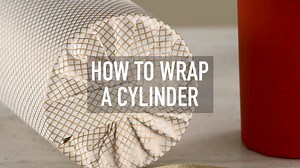 There's a really easy way to wrap a cylinder and make it look beautiful! Watch the video below and find more creative ways to beautify your presents here: http://ow.ly/VgOP30h567q | Martha Stewart