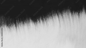 closeup black ink border spreading on wet paper top view