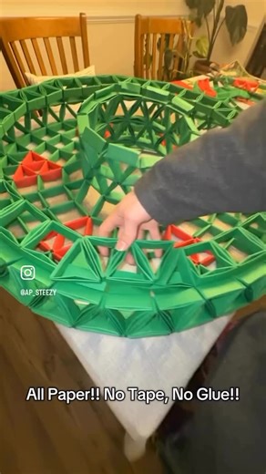 Ace Phelps on Instagram: "Another Progress Update on the Modular Origami Wreath!! It’s Finally coming together!! All paper, no tape, no glue!! Please let me know what you think!! Enjoy!!❤️🙏🎄 • • • #origami #modular #modularorigami #paper #paperart #art #artist #dmv #wreath #wreaths #christmas #sculpture #custom #allpaper #architecture #architect #archilovers #festival"