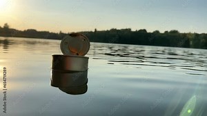 Tin can waste in lake water. Empty metal tin can garbage and food waste in ocean. Aquatic trash and Marine pollution. Steel tin cans to Recycling. Aluminum food tin can Waste, cans as garbage, litter