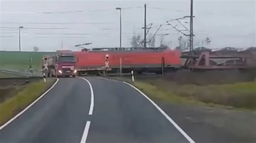 Watch as freight train smashes into truck SECONDS after driver escaped