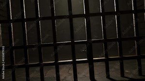 Prison Cell Bars Casting Shadows: Symbolizing Confinement and Loss of Freedom. metal prison cell bars casting shadows on the floor, representing themes of incarceration, confinement