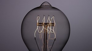 Light bulb filament lighting up - Free Stock Video