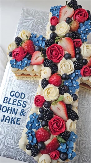 Beautiful cross cake for a First Holy Communion celebration, I am loving these colours together 🥰😍❤️🤍💙 #crosscake #lettercake #buttercreamflowers #fyp #fy #cake #cakedecorating #floralcake #caketok #buttercreamcake