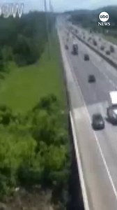 Dramatic footage captured by street cameras shows a semi-truck falling off the interstate and crashing into a creek below. The truck’s driver was treated for minor injuries, according to local reports. | ABC News