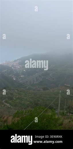 Foggy mountain view of Taormina coastline with winding road and elevated highway viaduct. Moving vehicles create dynamic contrast with calm misty landscape and Mediterranean scenery Stock Video Footage - Alamy