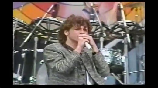 With their powerful rock infused with funk and new wave, INXS was one of the most influential bands in Australian and global music. They were known for their energetic live performances and the undeniable charisma of their lead singer, Michael Hutchence. The song "The One Thing" was one of their first international hits, and it perfectly introduced the band's unique and captivating sound to a worldwide audience. The song was co-written by all the members of the band INXS. "The One Thing" was wri