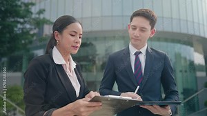 Asian female office worker and her bossy manager discussing company planning tasks, Business trading concept, hard work salary woman and her supervisor consulting about work standards and details