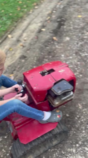 My grandson driving the mini dozer before I tore it down and re did it.