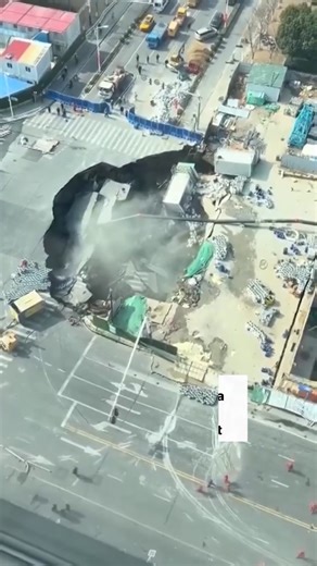 Watch: A massive sinkhole has opened up in Shanghai's Minhang District, swallowing a significant portion of the road and damaging nearby buildings. The collapse came just one day after workers uncovered a water leak while excavating for the Jiamin Metro Line. Credits: Reuters Read more at: https://www.khaleejtimes.com/world/asia/huge-pit-visible-shanghai-viral-sinkhole-video | Khaleej Times