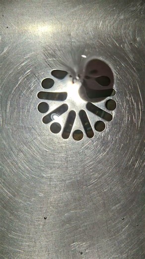 interesting sink drain and gurgling urinal