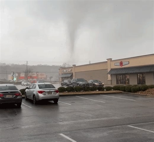 'Scary' Funnel Cloud Swirls Close to Buildings