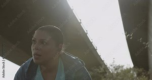 Plus size obese overweight black woman sports training wearing headphones, Body positive black female jogging exercising outdoors in city