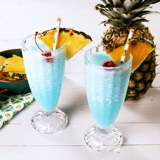Booze up and cool down this summer with Blue Hawaiian Coolers 🌴 Full recipe: http://dlsh.it/yg5rdo7 | Delish