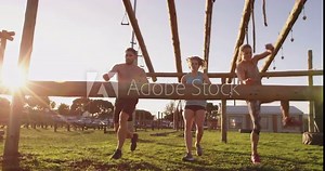 Young adults training at an outdoor gym bootcamp