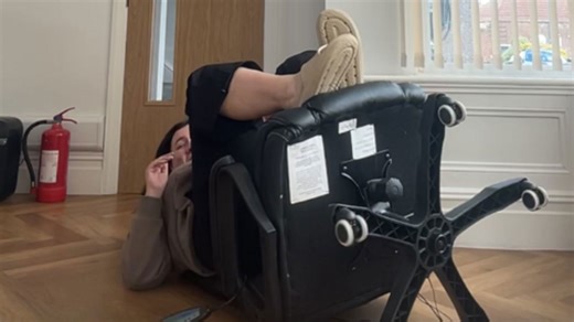 Girl tries to see if her chair snaps and ends up falling backward