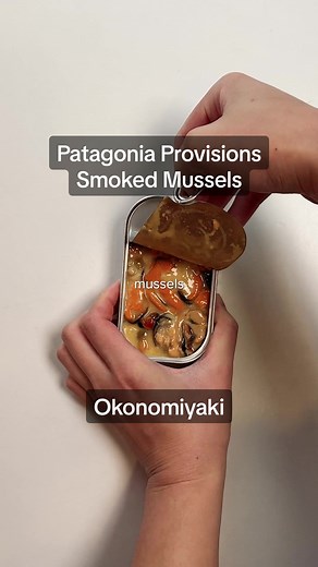 Tinned Fish Talk 🎣 Patagonia Provisions Smoked Mussels Okonomiyaki #ad 1 tin Patagonia Provisions smoked mussels 1/2 cup water 2/3 cup all purpose flour 1/4 tsp baking powder 1 tsp kosher salt 2 eggs 4 cups cabbage, shredded 1 green onion, thinly sliced 1 Tbsp oil 2 Tbsp ketchup 2 Tbsp worcestershire sauce 2 Tbsp kewpie mayo 2 Tbsp bonito flakes 1 tsp roasted seaweed, flakes Combine ketchup and worcestershire sauce in a small bowl to make okonomiyaki sauce. Set aside. Open and drain the liquid 