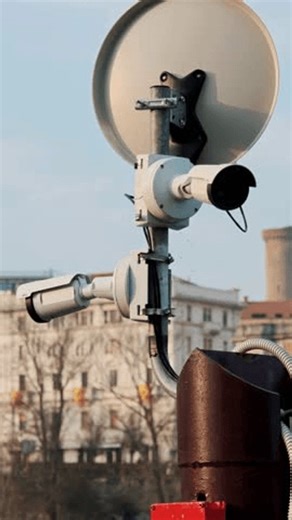 clip-4008474843-vertical-view-cctv-camera-pole-standing-front