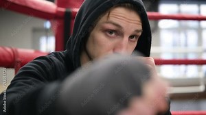 Man, boxer and personal trainer on ring background for practice, coaching or sports training at gym. Male person professional fighter in late evening for self defense, MMA or combat