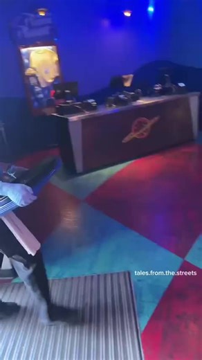 American is at Alien Pizza Planet in Disneyland to get food ‌ He shows the menu, the prices are outrageous. 1 regular size pizza is over $86…. How did Americans ever let corporations normalize ripping us off this hard