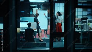 Footage from Outside the Window: Daily Meeting in the Office. Development Manager Making a Presentation of a Digital Whiteboard, Explaining New Business Strategy to Young Financial Specialists.