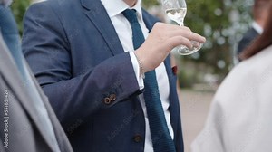 Businessmen in elegant office suit at corporate party, successful people having informal meeting at mansion terrace, colleagues relaxing at weekend, drinking exclusive alcohol beverages and talking