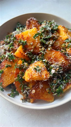 Parmesan roast swede & lentils - absolutely my favourite way to eat the humble swede. Recipe Makes 2 portions 1 medium squash, peeled, quartered and cut into 0.5cm slices 1 tbsp gram flour (or any flour of choice) 80g grated Parmesan (plus a little more to finish) 1 too picked thyme leaves 200g cooked, drained green lentils 1 tbsp chopped parsley Half a small shallot, finely diced 1 clove garlic, finely grated 1 tbsp red or white wine vinegar 1 tsp runny honey Salt and pepper Olive oil 1. Place 