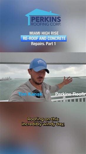 Tim with Perkins Roofing here on this incredibly windy day. You can see beautiful Port Miami and Fisher Island behind me as we’re on Phase 1 of our Key Biscayne re-roof project. Phase 1 is looking good so far, but there are a few pending items. The building needs funds to keep the work going, so let’s walk through what’s happening. Behind me, you’ll see the new railings were installed. But unfortunately, there are some issues here. This is actually the only item on this project that we’re not ha