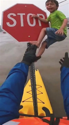 Man saves little boy from dangerous flood
