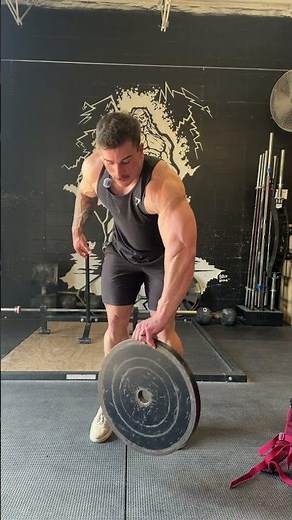 Attempting the 45lb plate flip.