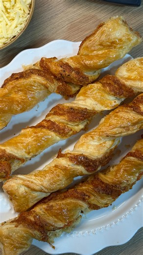 Puff Pastry Cheese Straws Grate Hack: Use the Flex Prep grater disc for even shreds that melt and puff perfectly. Ingredients: 1 ready-rolled puff pastry sheet 100g mature cheddar, grated 1 egg, beaten Pinch of smoked paprika or chilli flakes (optional) Method: Unroll the puff pastry and brush lightly with beaten egg. Scatter grated cheese evenly across one half; fold the other half over and press gently. Roll out lightly and slice into 1cm strips. Twist each strip and brush with more egg. Air f