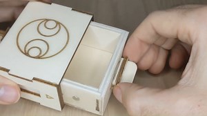 Small puzzle-box using hidden magnetic locking mechanism