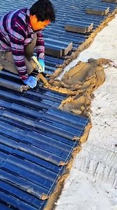 the process of installing the roof layer on the concrete slab