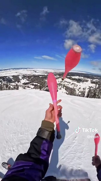 Impressive Ski Juggling on Snowy Mountain