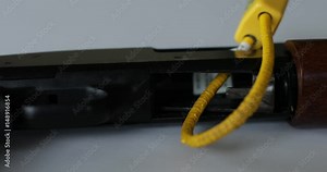 A trigger lock on a shotgun for safety