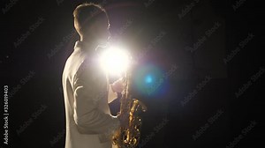 Talented musician play melody on saxophone in spotlight. Live performance of one calm famous music player on instrumental classic concert show. Culture occupation art of elegant artist people of skill