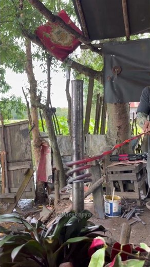 straightening a motorcycle spring before turning it into a rubber tapping tool..!!