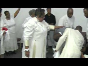Laying Hands...Pastor Cynthia Moore & Apostle Leviticus Moore