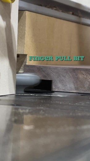 Using a finger pull bit (made by Amana tools) to cut a finger grip on these integral drawer pulls. Works great! #woodworking #reels #routerbit #woodshop #tools #inprogress | Boundary Fog Furniture