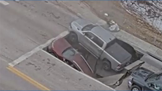 Caught on Camera! A sinkhole opened up on a street in Omaha, Ne., swallowing 2 vehicles