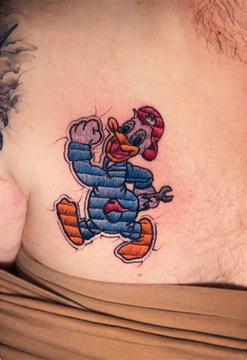 Embroidery-Style Donald Duck Tattoo by Expert Artist