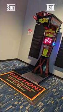 Son vs Dad on a boxing punching machine. Close match!!